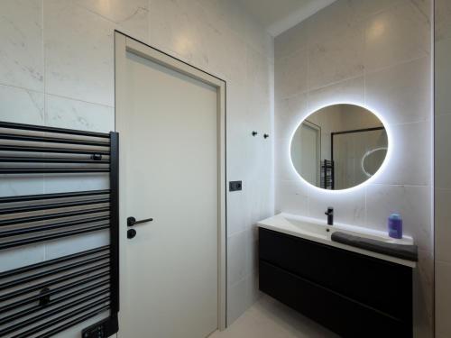 a bathroom with a sink and a mirror at Le Rhône - Aux Charmes Lyonnais ' in Lyon
