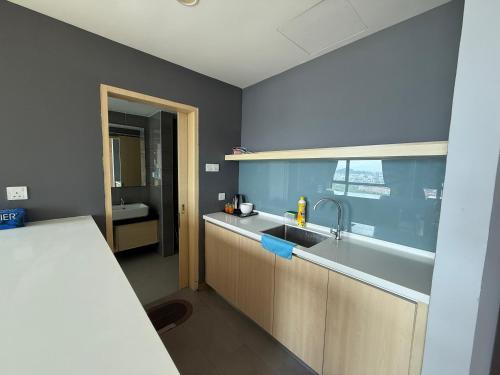 a kitchen with a sink and a counter top at Swiss Cozy Studio Kuantan City View Imperium Residence in Kuantan