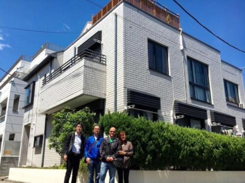 a group of people standing in front of a building at Ys Bed & Kitchen Tokyo #HY1 in Tokyo