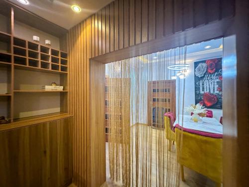 a room with a bed and a window in a room at Engeemos Bookastay Apartments in Abeokuta
