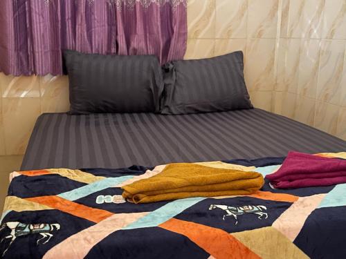 Llit o llits en una habitació de The Panda Backpacker Hostel