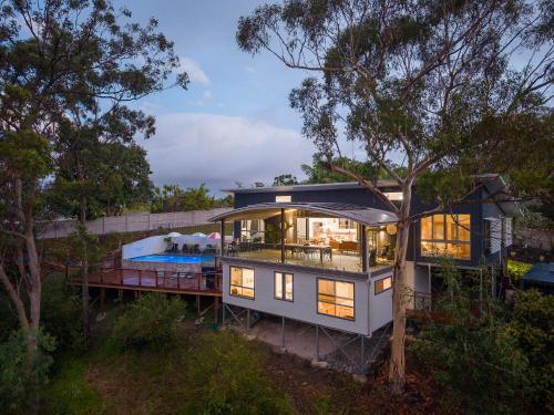 a large house with a pool on top of it at Hinterland Dreamers Poolside Retreat in Yandina Creek