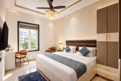 a hotel room with a large bed and a window at Hotel Byland Inn- Near Connaught Place And 5 Minutes From New Delhi Station in New Delhi