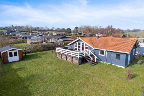an aerial view of a home with an orange roof at Summer House With Sauna Near Følle Strand in Rønde