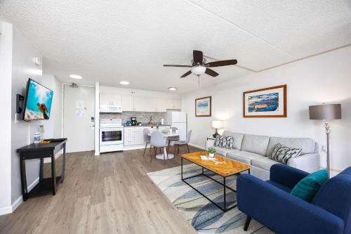 a living room with a couch and a table at Warm Aloha Vibes, Mountain Views, Short Walk to Beach, and Free Parking in Honolulu