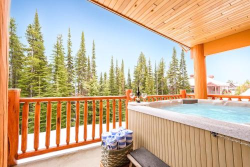 a deck with a swimming pool on top of a house at Best Ski-in out 3 Bdrm Chalet, with Hot Tub in Big White