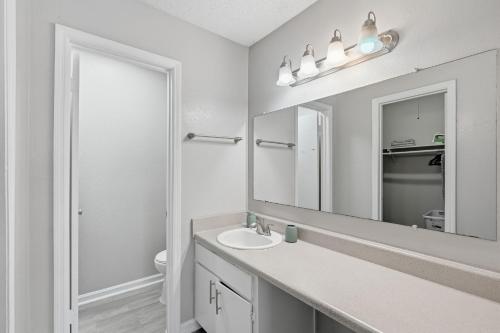 a bathroom with a sink and a mirror at Comfort & Convenience in Stone Mountain in Stone Mountain