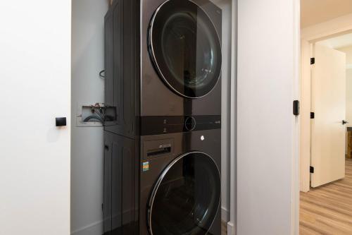 two washing machines stacked on top of each other at Regency Modern Apartments in Glendale