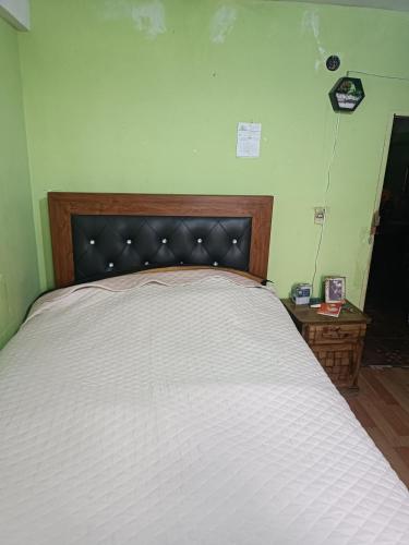 Llit o llits en una habitació de Posada Rossy