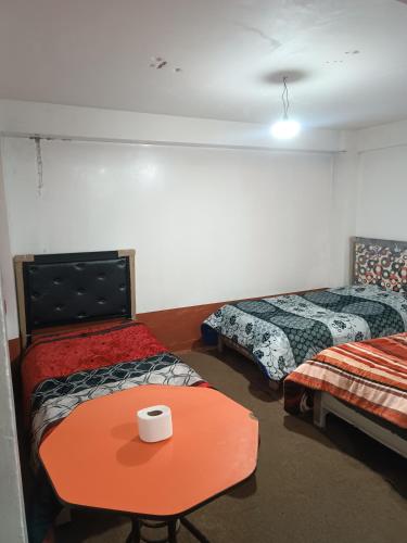 Llit o llits en una habitació de Posada Rossy