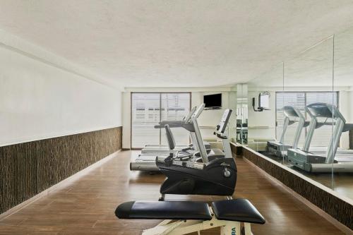 a gym with three treadmills and a treadmill at Fiesta Inn Express Chihuahua in Chihuahua