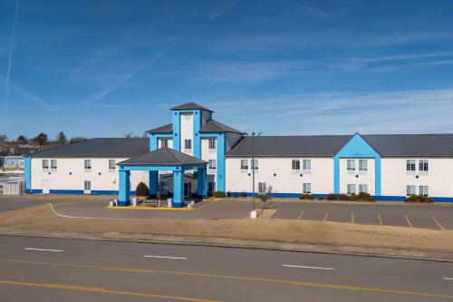 a building with a gazebo in front of a road at Days Inn by Wyndham Dodge City in Dodge City