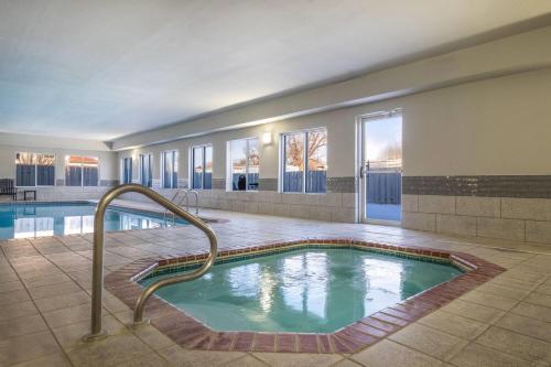 a pool in a hotel with a hot tub at Days Inn by Wyndham Dodge City in Dodge City