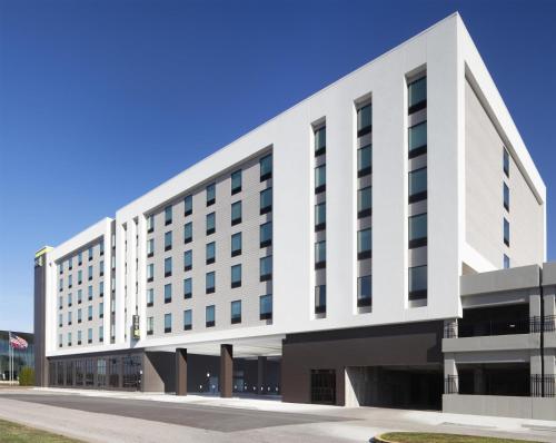 an external view of a white building at Home2 Suites By Hilton Owensboro in Owensboro