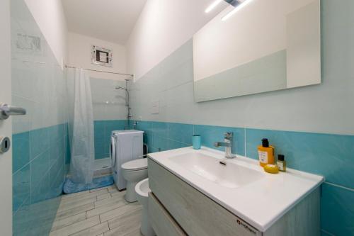 a bathroom with a sink and a toilet at VivimiHome - Casa Tiberio in Conca dei Marini