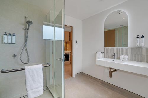 a bathroom with a shower and a sink at Luna Lodge Wānaka - digital check-in only in Wanaka