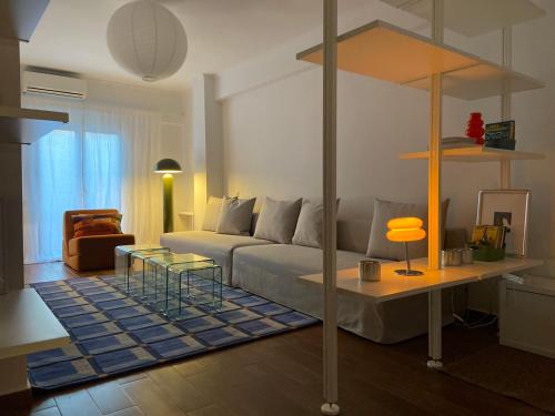 a living room with a couch and a table at RYB Colour Apartment in Patra