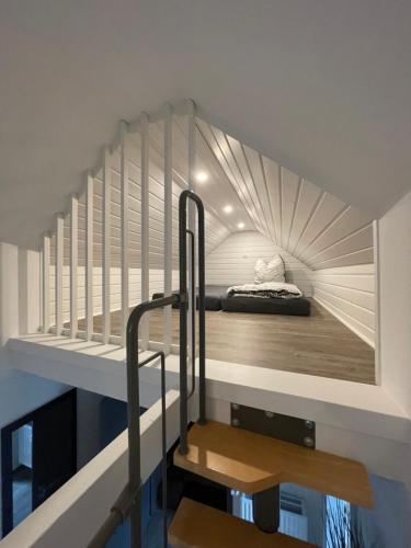a small room with a bed in the ceiling at B&K Immobilien GbR in Tangermünde