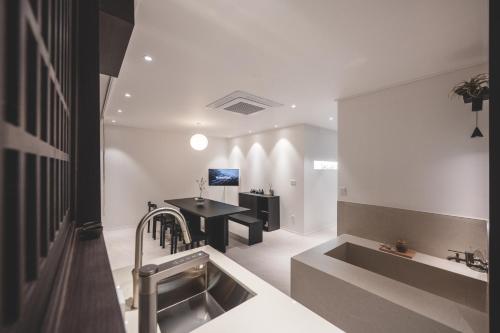 a kitchen with a sink and a table at GOYURe 고유리 in Seoul