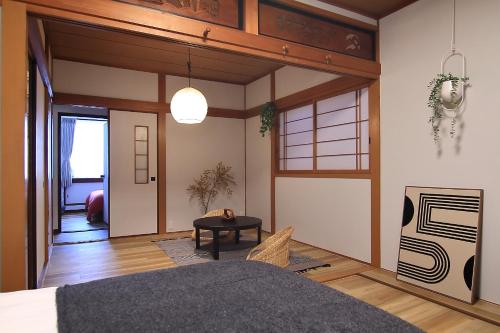 Leisure Stay Yodogawa, Near Umeda, 1 stop to JR Osaka and 3 min walk to station, Ideal for Large Group and Family, Whole House Rental 5 BR 100m2 for 12ppl max, Newly renovated Japanese and Nordic style