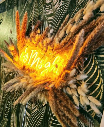 a close up of a yellow sign on a plant at INsight - workcation oldtown in Ingolstadt