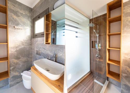 a bathroom with a sink and a shower at Delux SeaSide Victorious Villa by HolidayKeys in Kyrenia