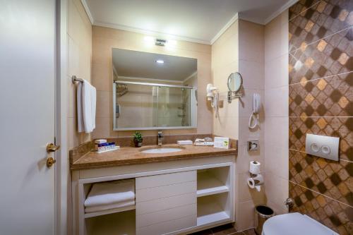 a bathroom with a sink and a mirror at Villa Side Residence in Side