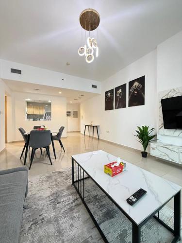 Large 1BR Apartment with Balcony in JVC - JLiving