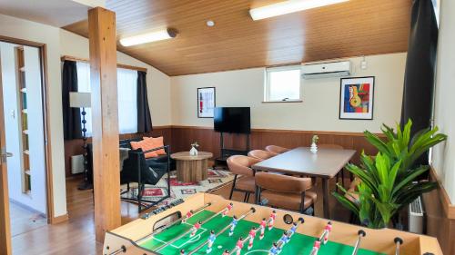 a living room with a pool table in a room at 9Stay函館 in Hakodate