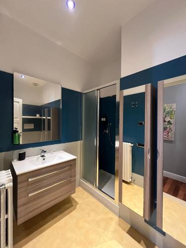 a large bathroom with a sink and a shower at Leonardo rooms in Avellino