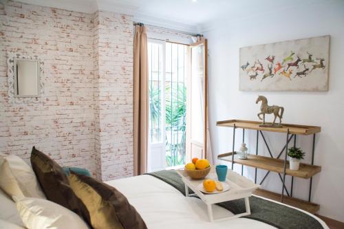 Een zitgedeelte bij Apartamentos Sevilla Palace