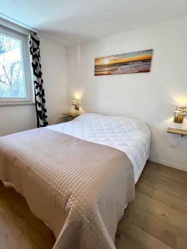 a bedroom with a bed and a window at Casa Verde Oliva - WelcHome in Rocca San Giovanni
