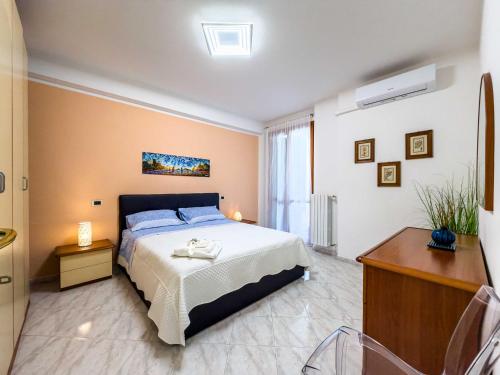 a bedroom with a bed and a dresser in it at Rio Apartment cà di Euro with parking in Riomaggiore