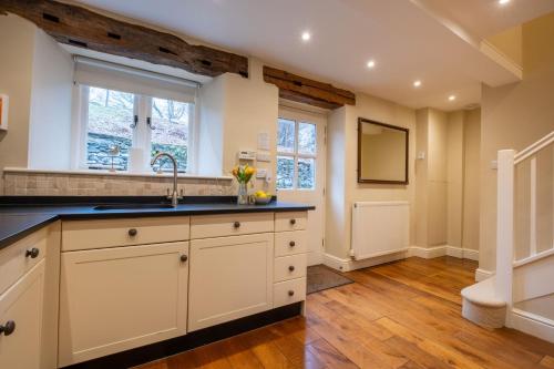 a kitchen with a sink and a window at Rose Barn in Hawkshead