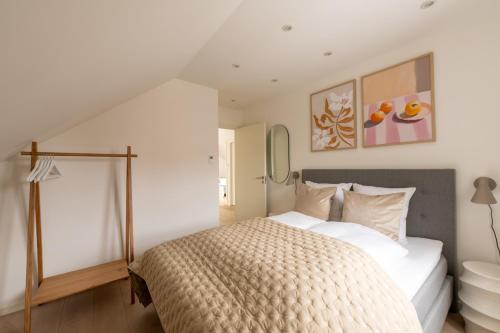 a bedroom with a bed and a window at Sunlit Loft Apartment in Valby with Parking for 8 in Copenhagen