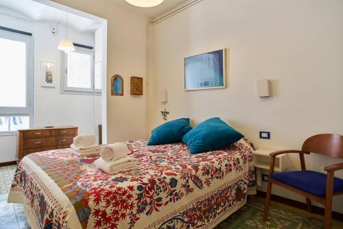 a bedroom with a bed with towels on it at My Home in Barcelona in Barcelona