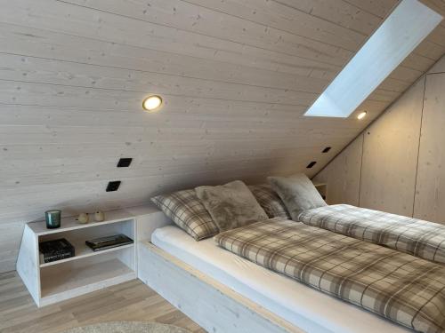 a room with two beds in a attic at Chalet Belveder SPORT in Železná Ruda