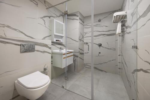 a bathroom with a toilet and a shower at Ginger Gurugram, Sector 1 in Gurgaon