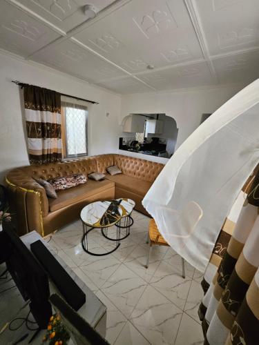a living room with a couch and a table at Malindi Jerere BnB in Malindi