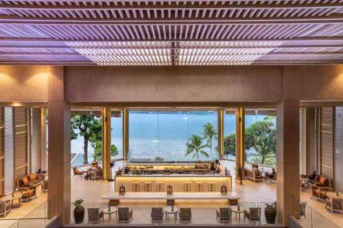 a large lobby with a view of the ocean at Amari Phuket in Patong Beach