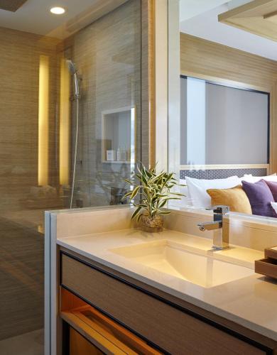 a bathroom with a sink and a shower at Amari Phuket in Patong Beach