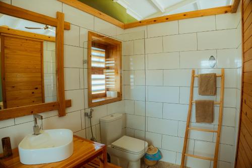 a bathroom with a sink and a toilet at Oasis212 Dakhla in Dakhla