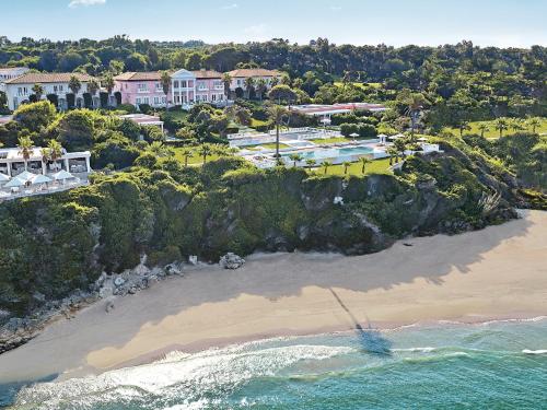 an aerial view of a beach with a resort at Mandola Rosa, A Resort to Live in Loutra Killinis