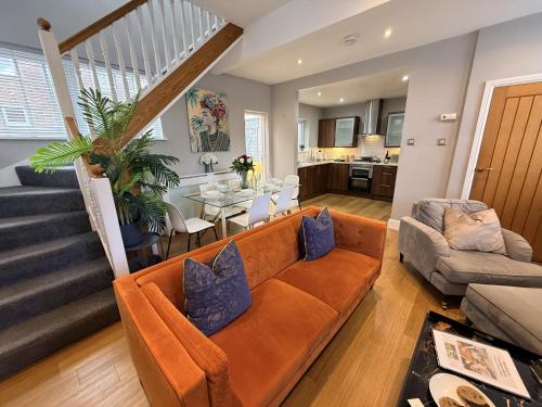 a living room with a couch and a table at Luxury 3-bed Victorian Townhouse Hosted by Hutch Lifestyle in Leamington Spa
