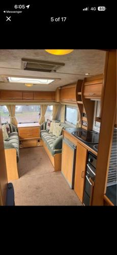 a small kitchen and living room in an rv at Maltese Sunshine in Naxxar
