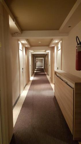 an empty corridor of an office building with a long hallway at Apartment Suncani Vrhovi in Kopaonik