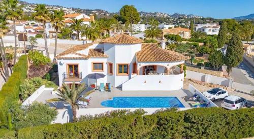 an aerial view of a house with a swimming pool at Villa Martí in Calpe