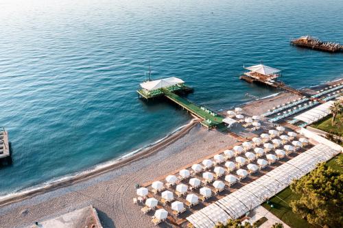 an aerial view of a beach with umbrellas at Dosinia Luxury Resort-Ultra All Inclusive in Beldibi