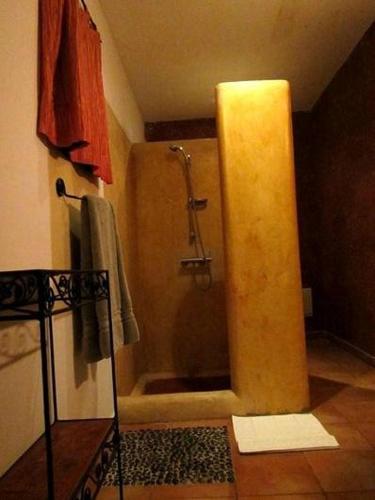 a bathroom with a shower with a shower at Oloimala Mara Camp in Gatunga