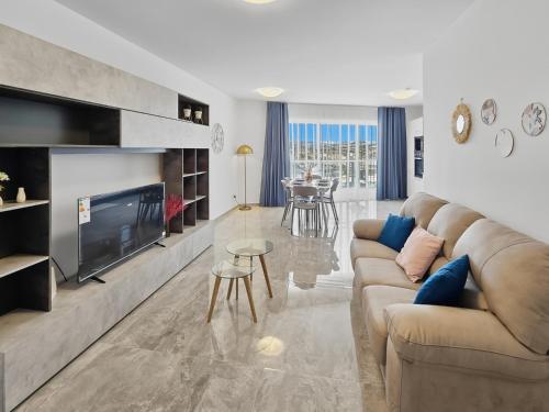 a living room with a couch and a flat screen tv at Open Park Views 2 BR modern apartment 4 in St. Paul's Bay
